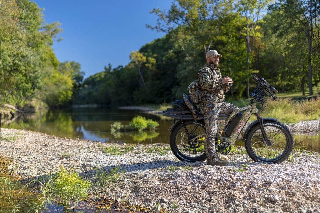 A rugged off-road e-bike on a mountain trail.